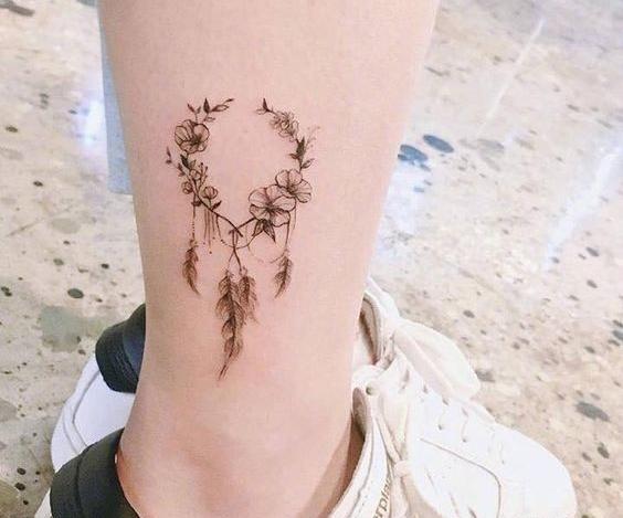 عکس تاتو قاصدک روی مچ پا