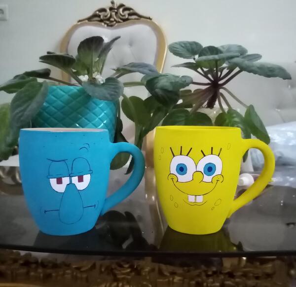 عکس نقاشی فانتزی روی لیوان سفالی