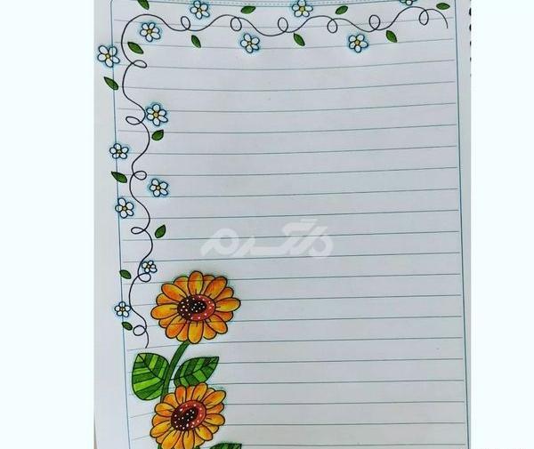 عکس نقاشی گل در کنار دفتر مشق