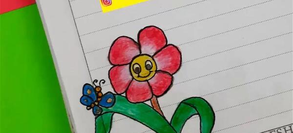 عکس نقاشی گل کنار دفتر املا