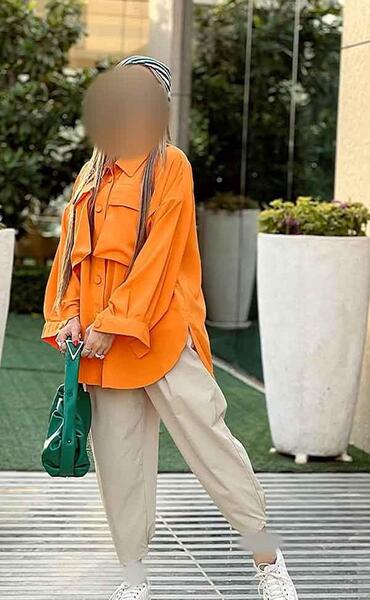 عکس دختر با مانتو نارنجی