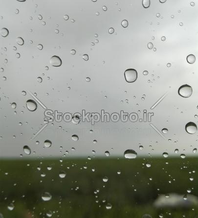 عکس شیشه باران زده