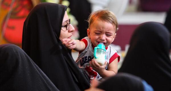 عکس همسر و فرزند شهید حججی