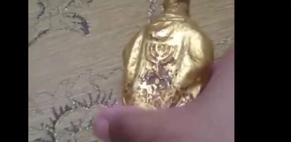 عکس مجسمه طلا زیر خاکی
