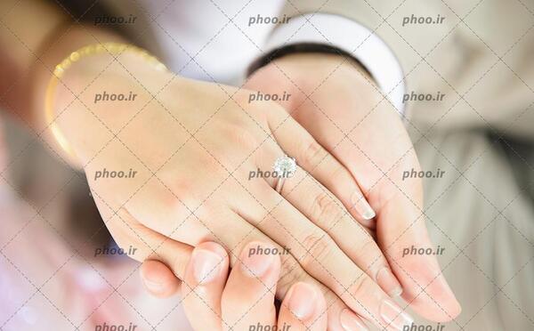 عکس دست عروس داماد با حلقه ازدواج
