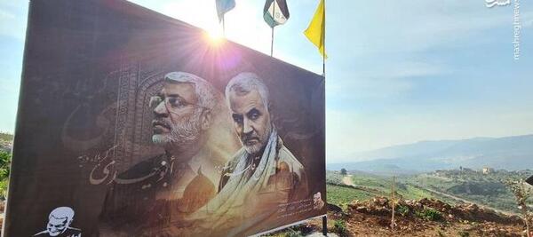 عکس حاج قاسم و پرچم فلسطین