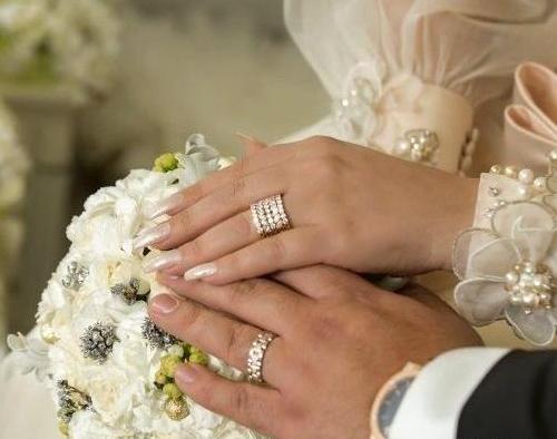 عکس دست با حلقه عروس و داماد