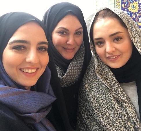 عکس حرم امام رضا با گل نرگس