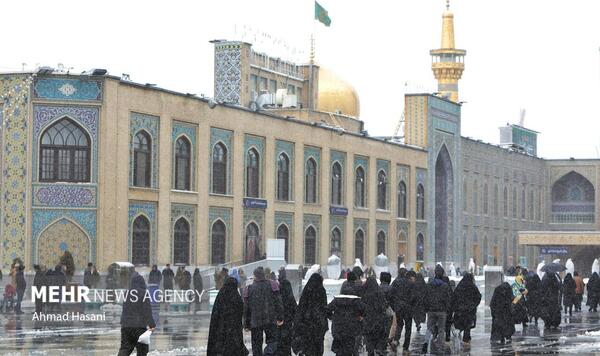 عکس حرم امام رضا در شب برفی