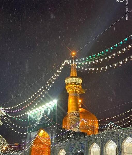 عکس حرم امام رضا در شب برفی