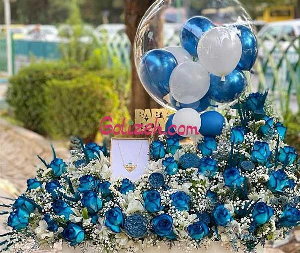 عکس نوزاد پسر با گل