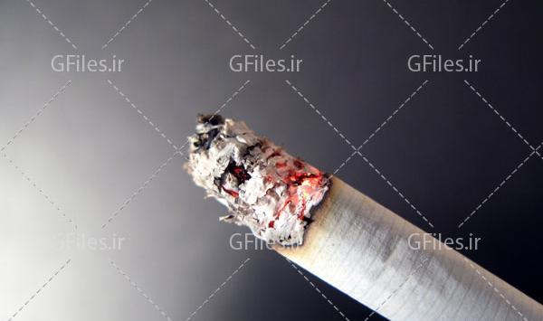 عکس سیگار روشن در دست