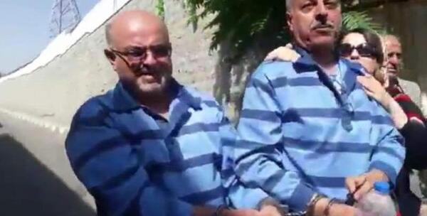 عکس زندانی با دستبند