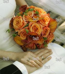 عکس دست عروس و داماد با دسته گل