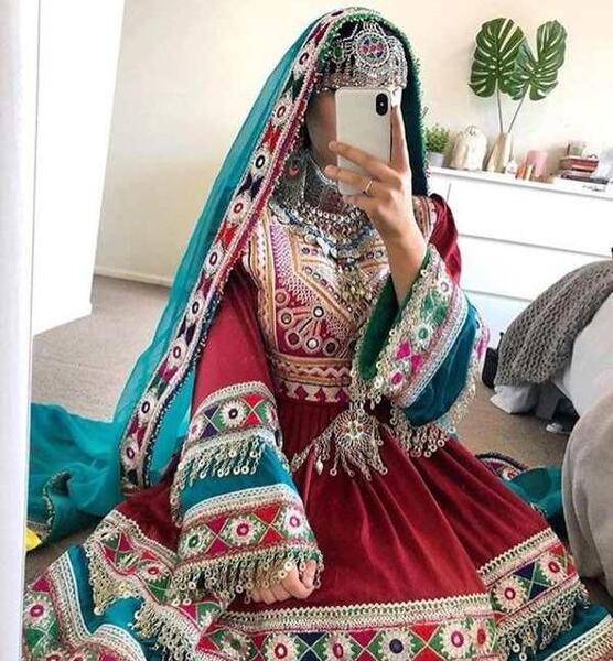 عکس دختر افغانی با لباس محلی