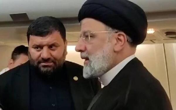 عکس بادیگارد رئیسی که داخل هلیکوپتر بود