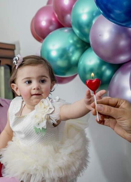 ژست عکس تولد کودک کنار دریا