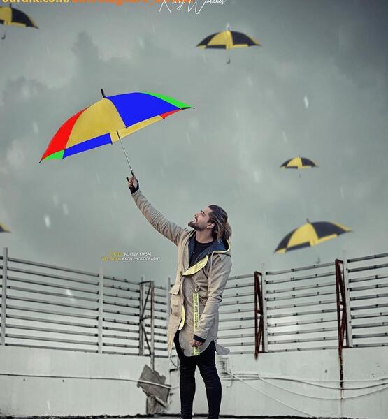 عکس امیر مقاره با چتر
