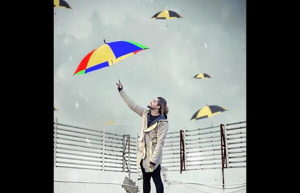 عکس امیر مقاره با چتر