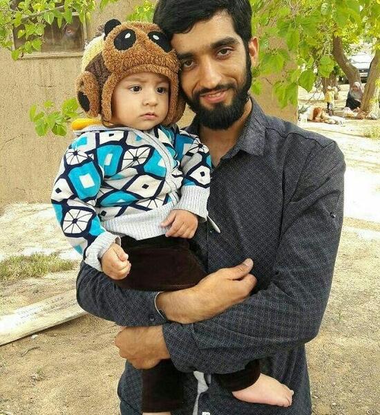 عکس شهید محسن حججی و پسرش