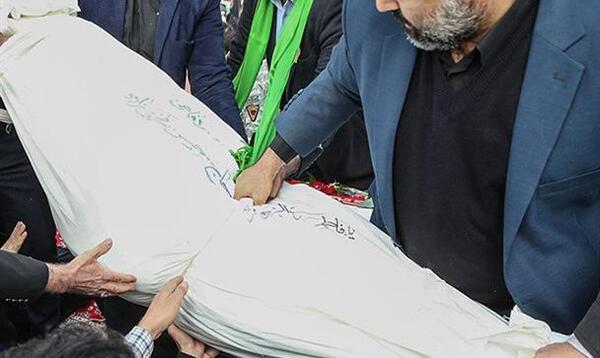 عکس شهید فخری زاده در تابوت