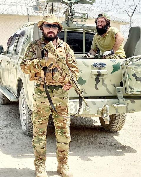 عکس طالبان با لباس نارنجی