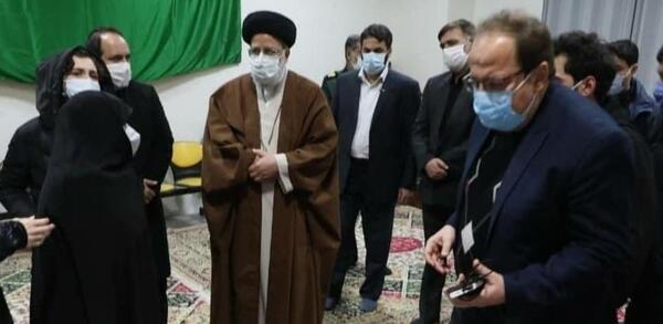 عکس رئیسی با شهید فخری زاده