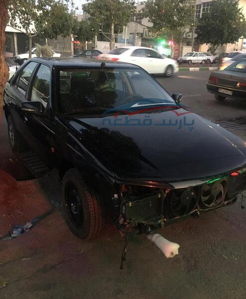 عکس پژو مشکی تصادفی