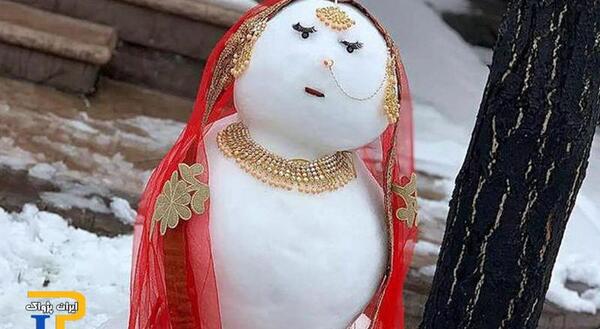 عکس ادم برفی و دختر
