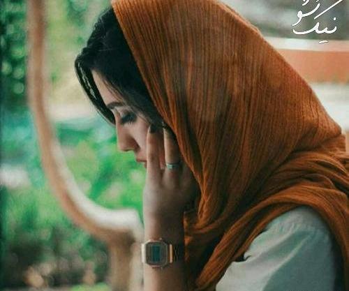 عکس دختر غمگین لب پنجره