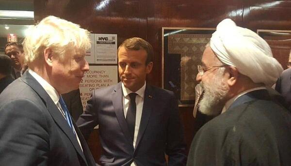 عکس خنده روحانی با جانسون